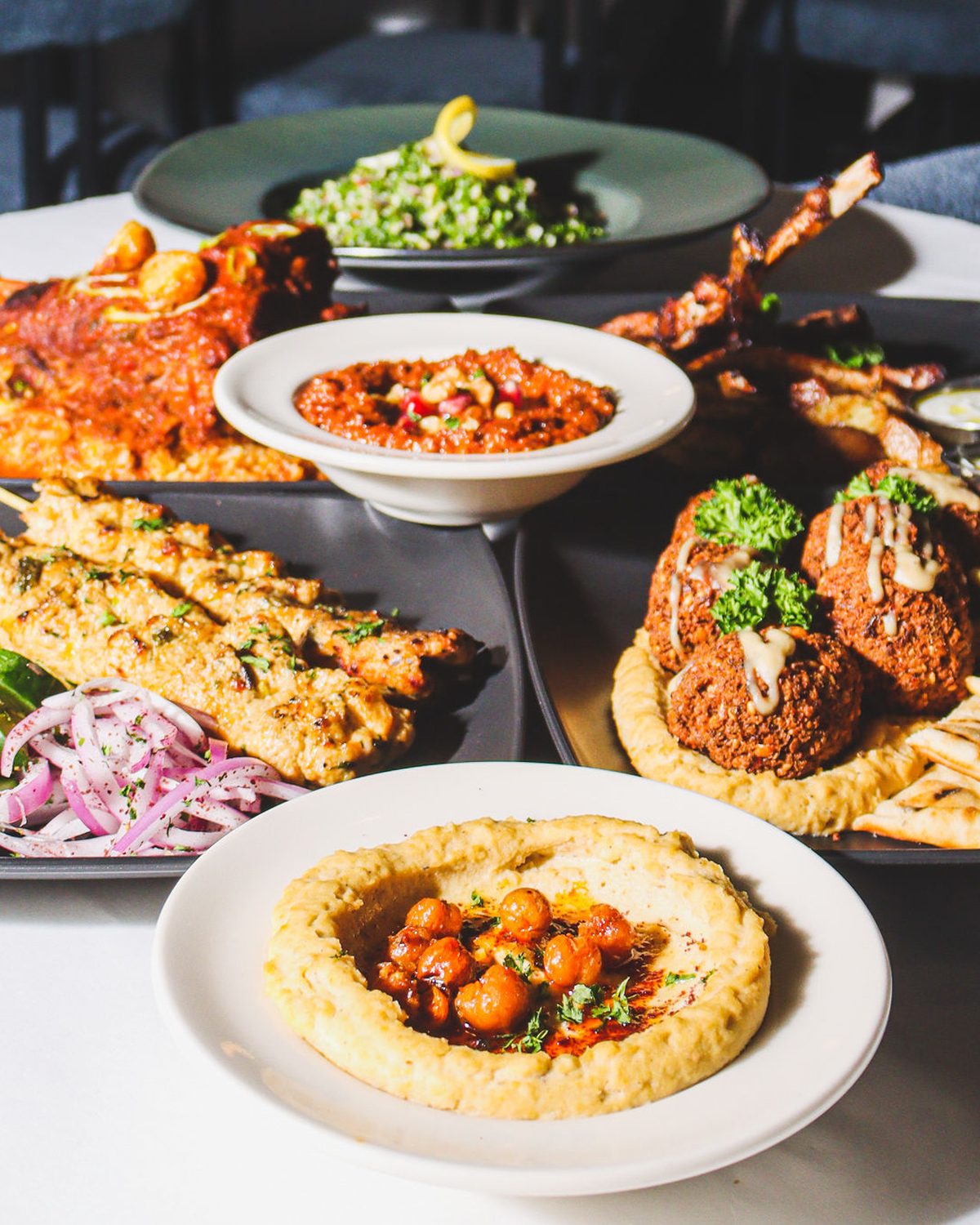 Mezze, hummus and pita prepared in large format