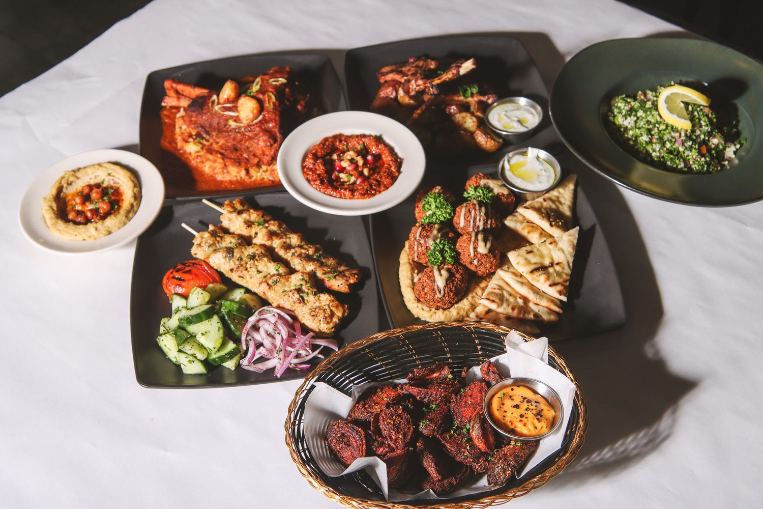 Grill platters plated for a large gathering