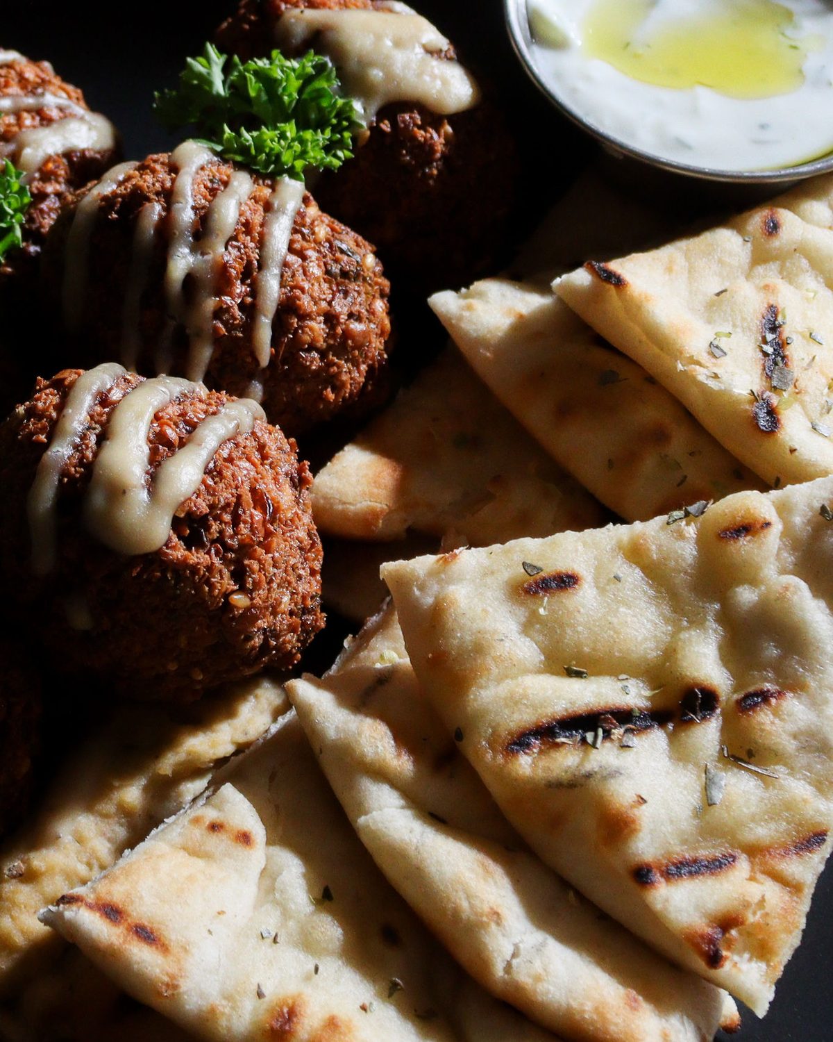 House falafel with tahini drizzle and warm grilled pita