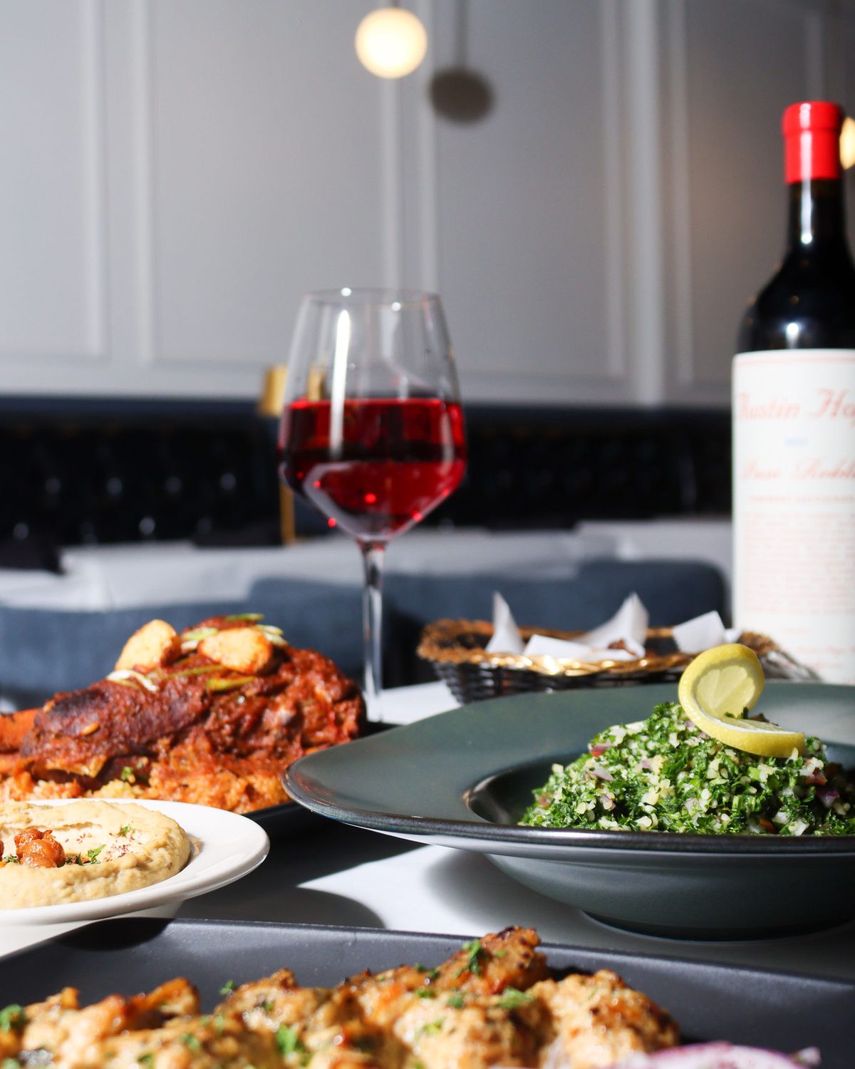 A dressed table in the dining room with wine poured