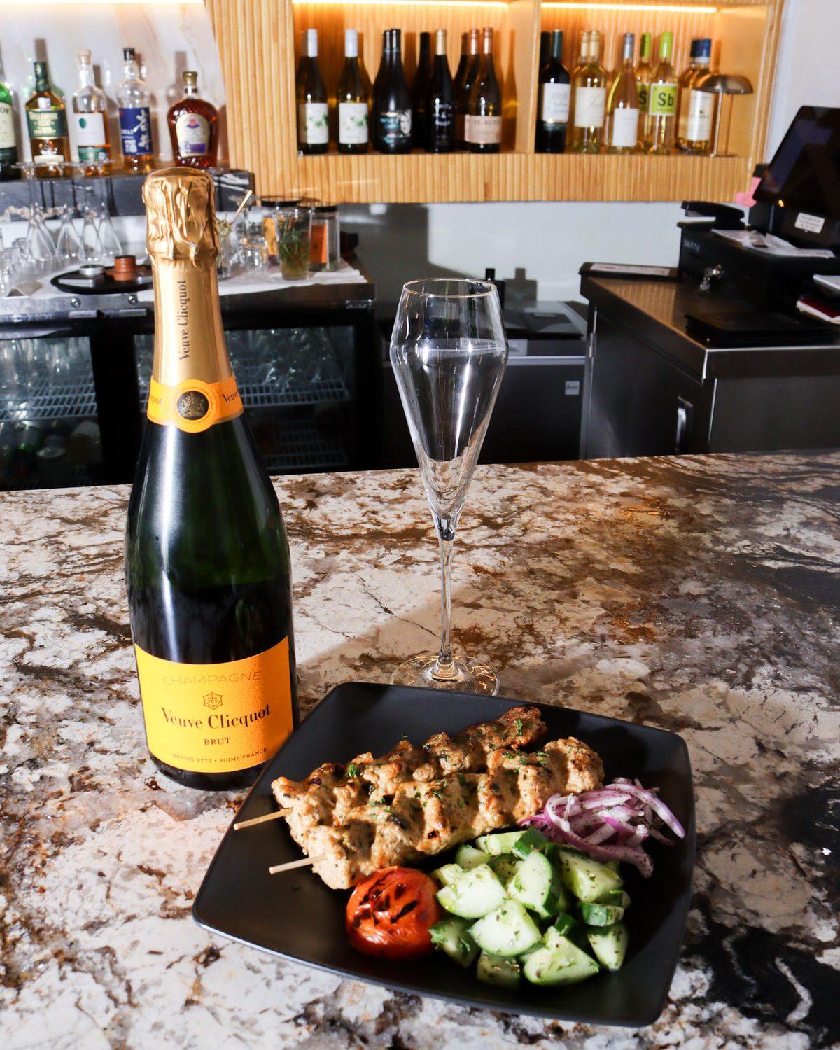 Chicken kabob and champagne at the bar