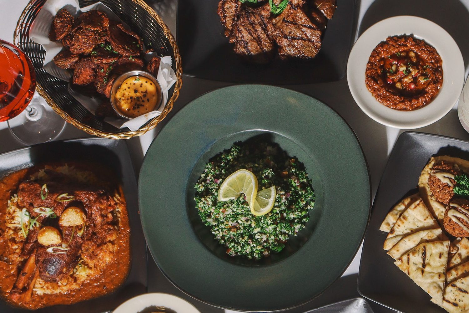 A full table of mezze and grill plates