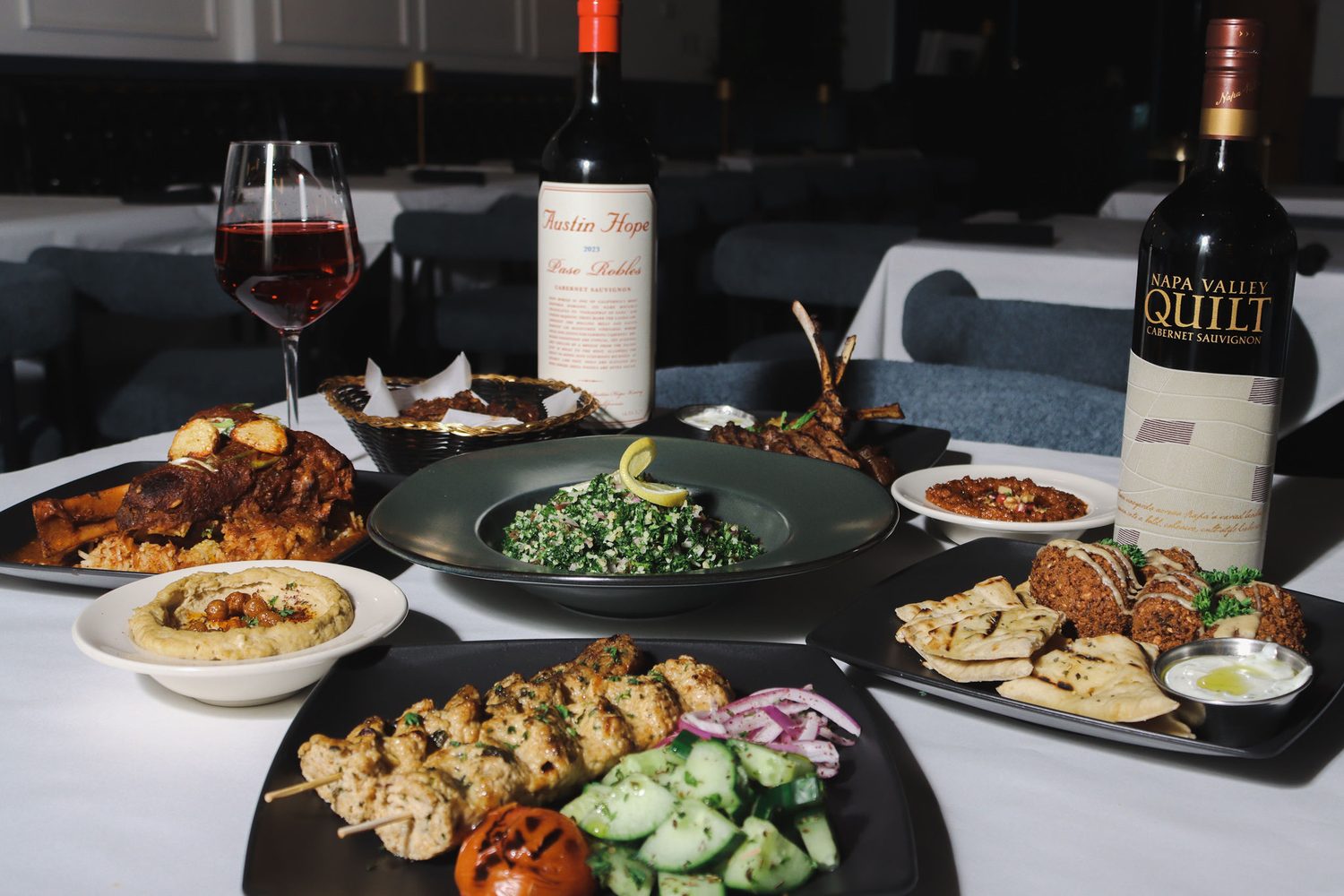 A long table of shared plates at Fusion