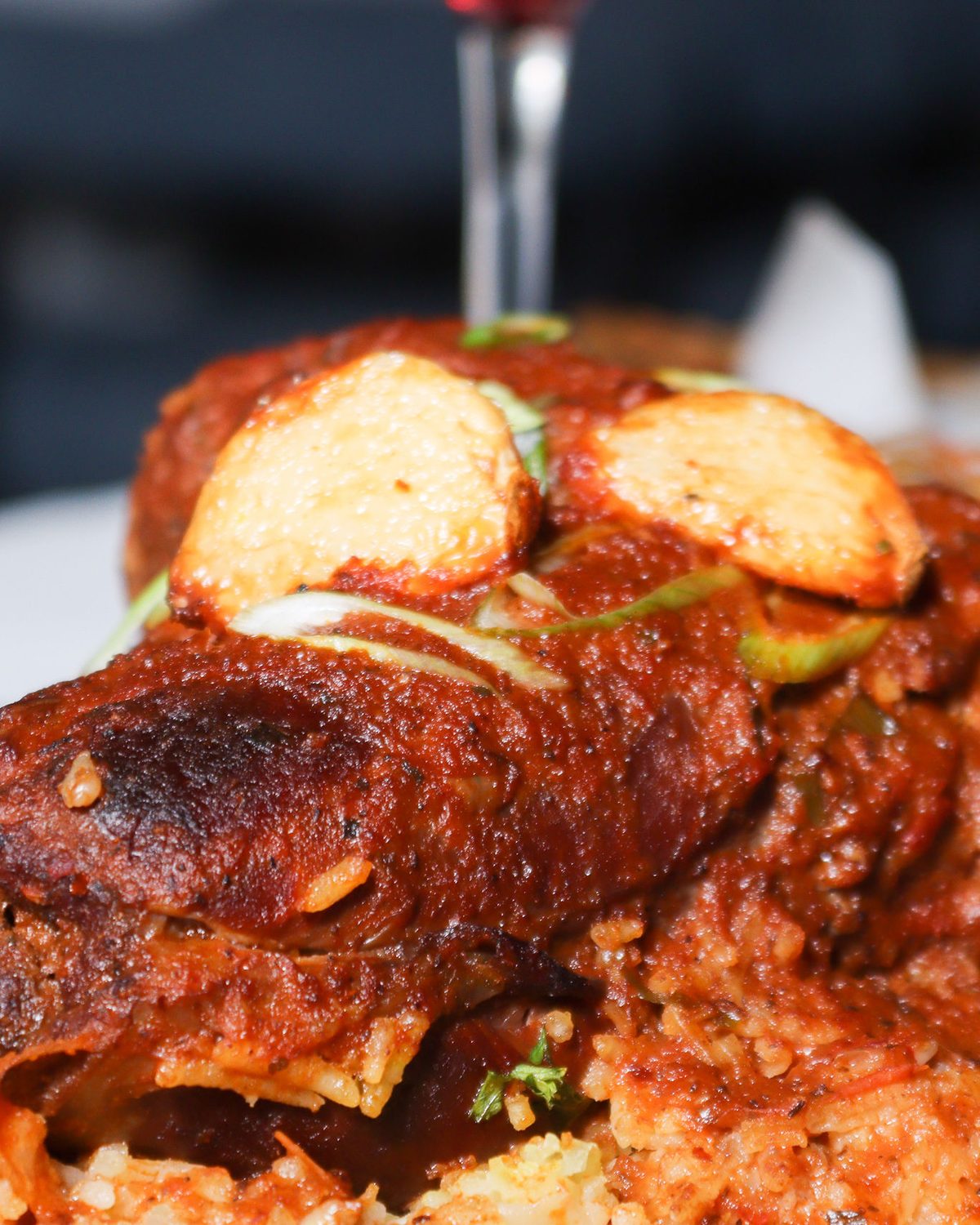 Lamb shank plated over saffron rice